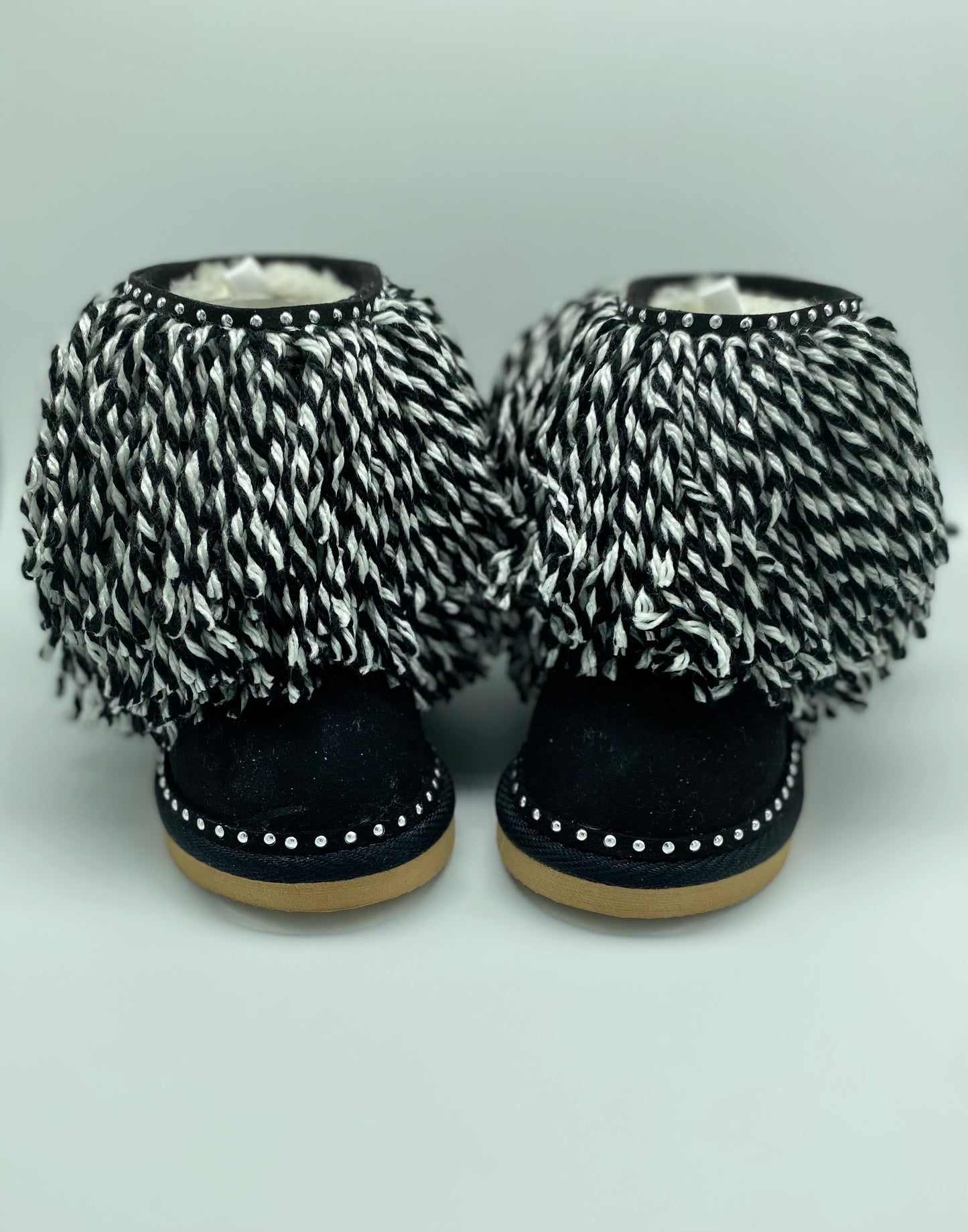 Zebra print fringe boots